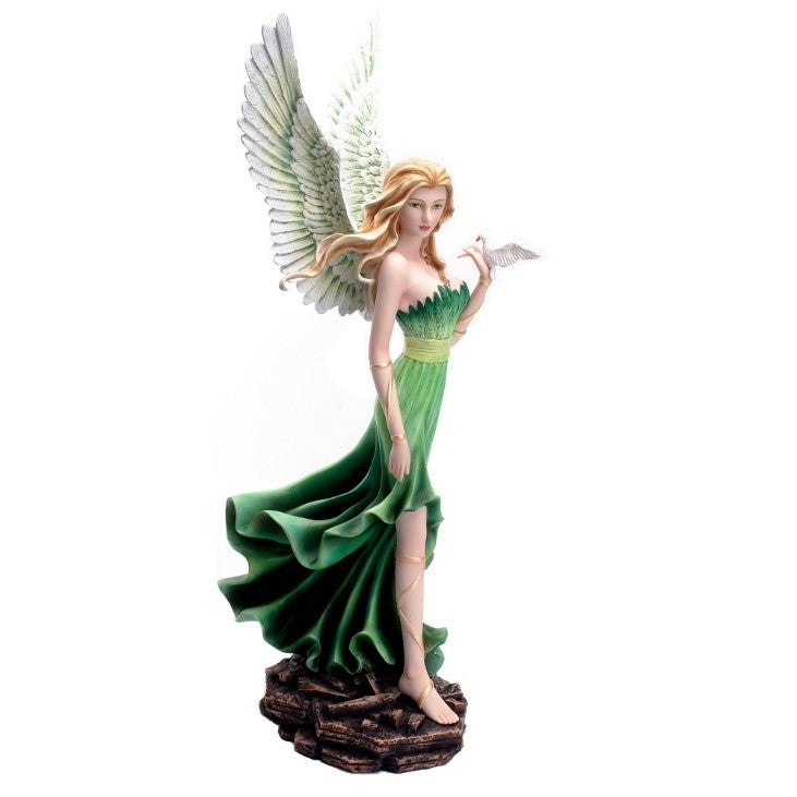 A statuette of a beautiful woman with long blonde hair and white bird wings wearing a long flowing green dress, perching a dove on her finger.