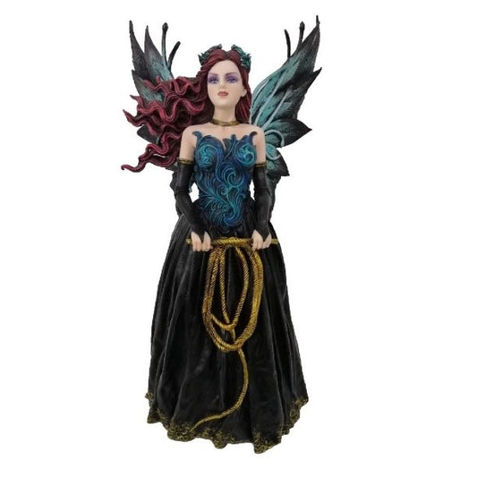 A statuette of an evil queen with blue butterfly wings, wearing a blue bodice and black ankle-length skirt, holds a very long whip in loops and stares menacingly forward.