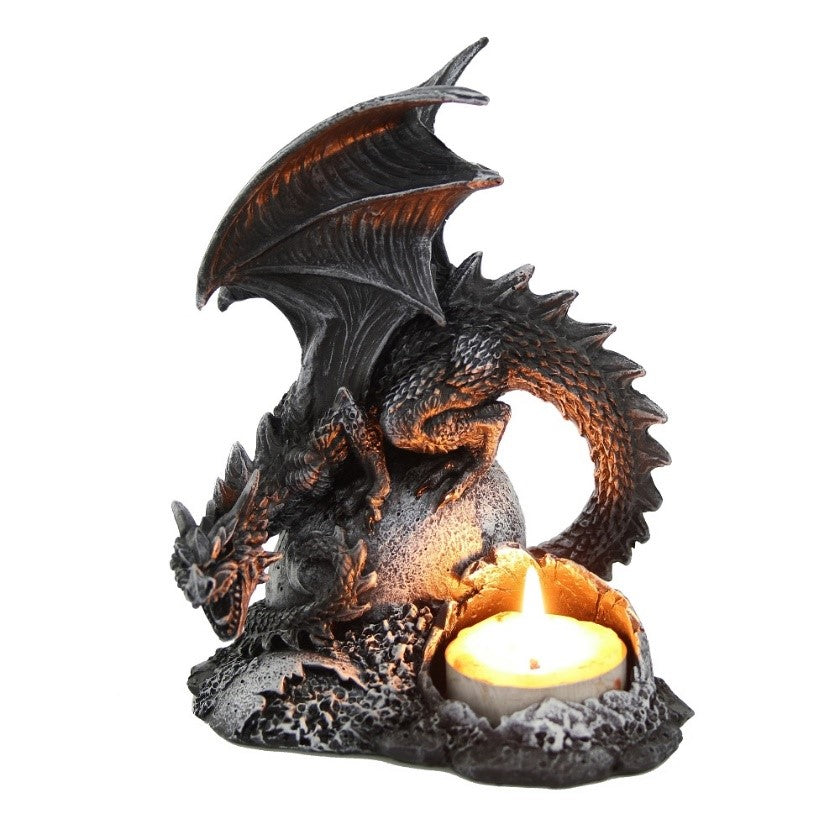 A ‘tealight’ candle, heating the rock on which a menacing black dragon sits.